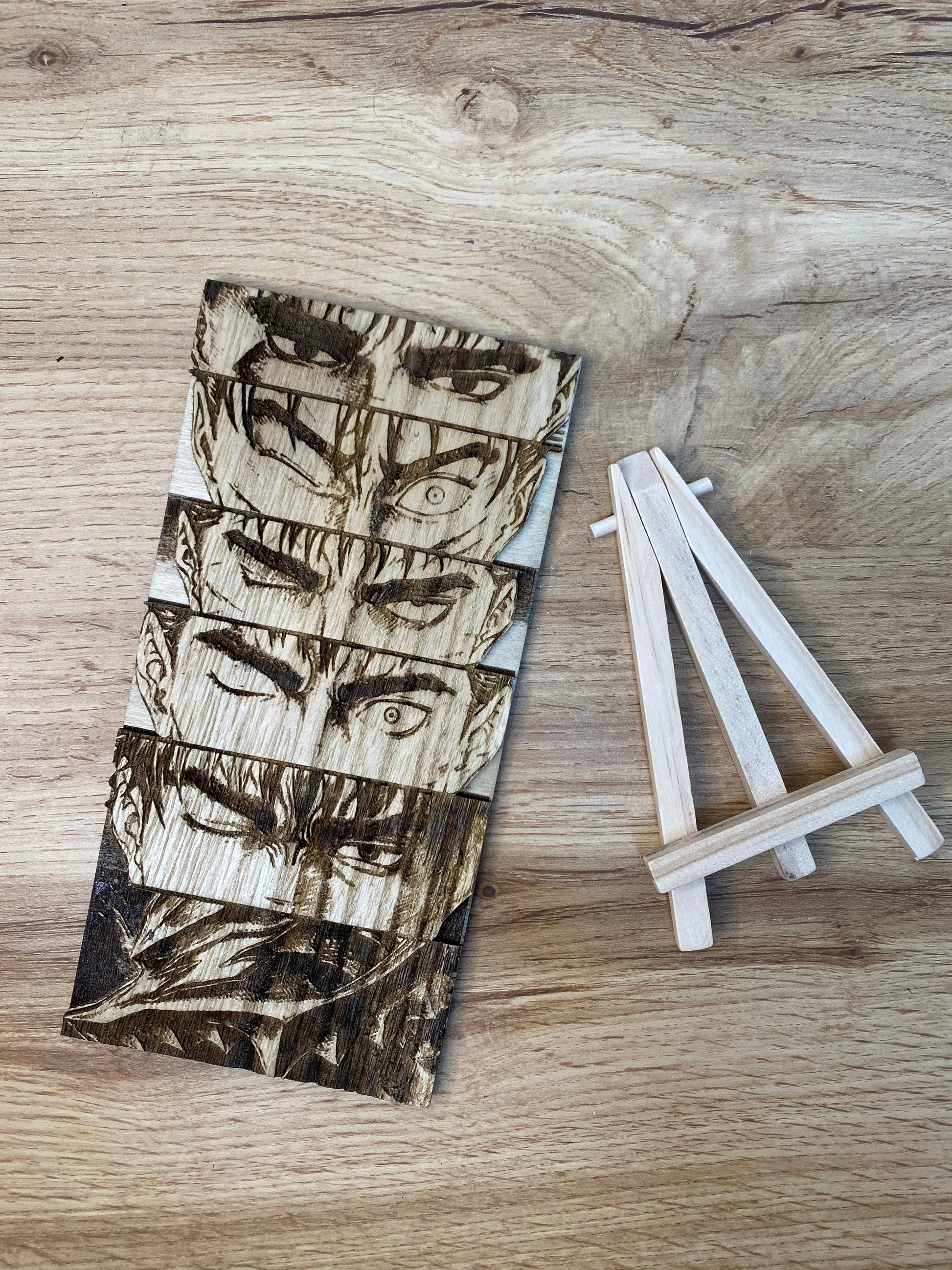 Gravure sur bois berserk – Guts « L’évolution du regard » Bois et Traits