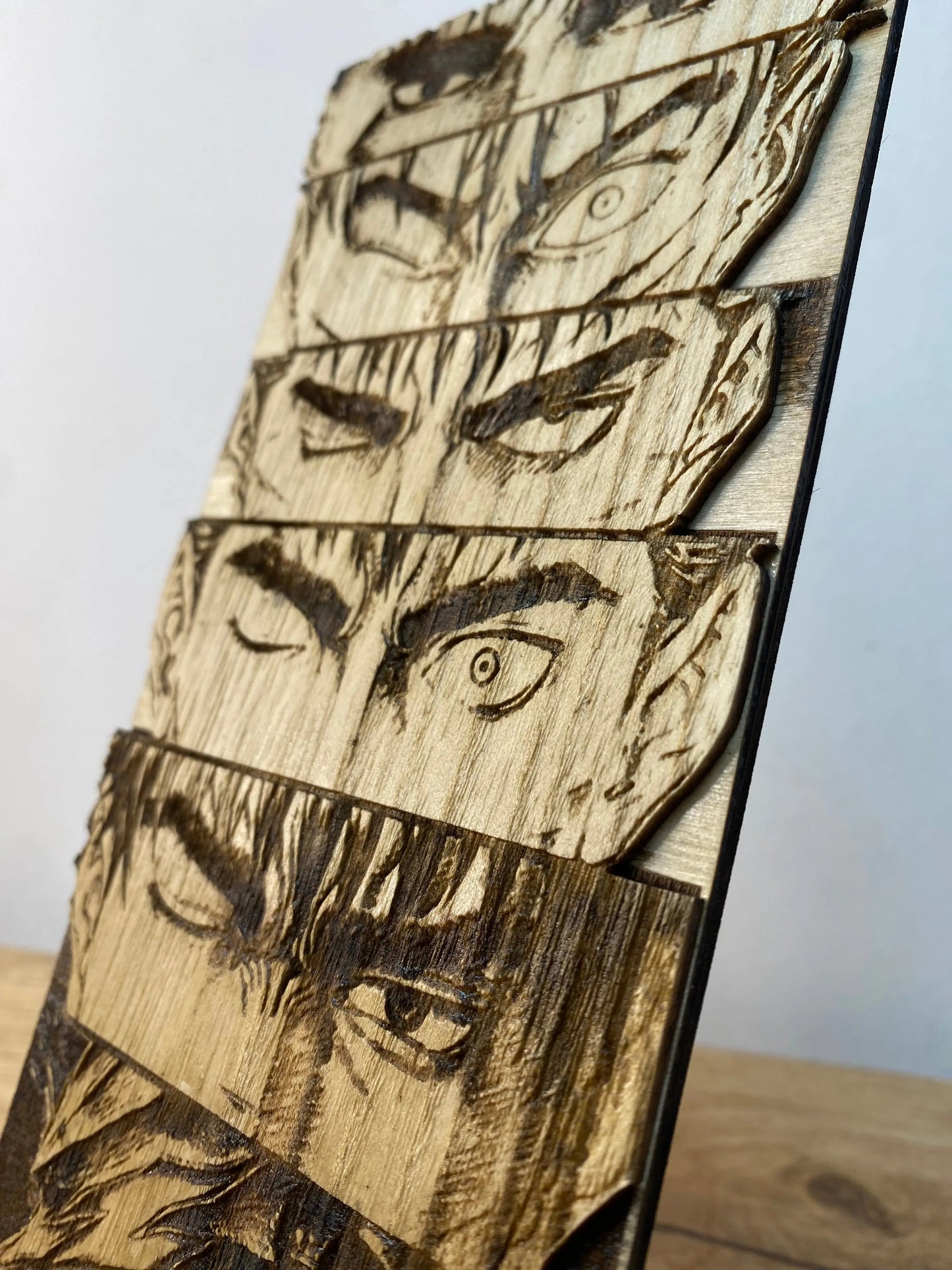 Gravure sur bois berserk – Guts « L’évolution du regard » Bois et Traits